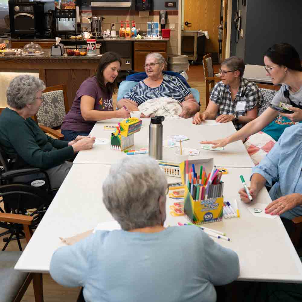 A caregiver supporting a senior resident at Sheboygan Senior Community