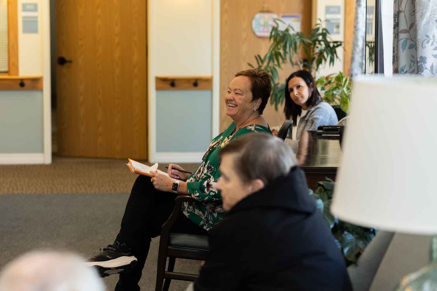 Caregivers collaborating on the floor