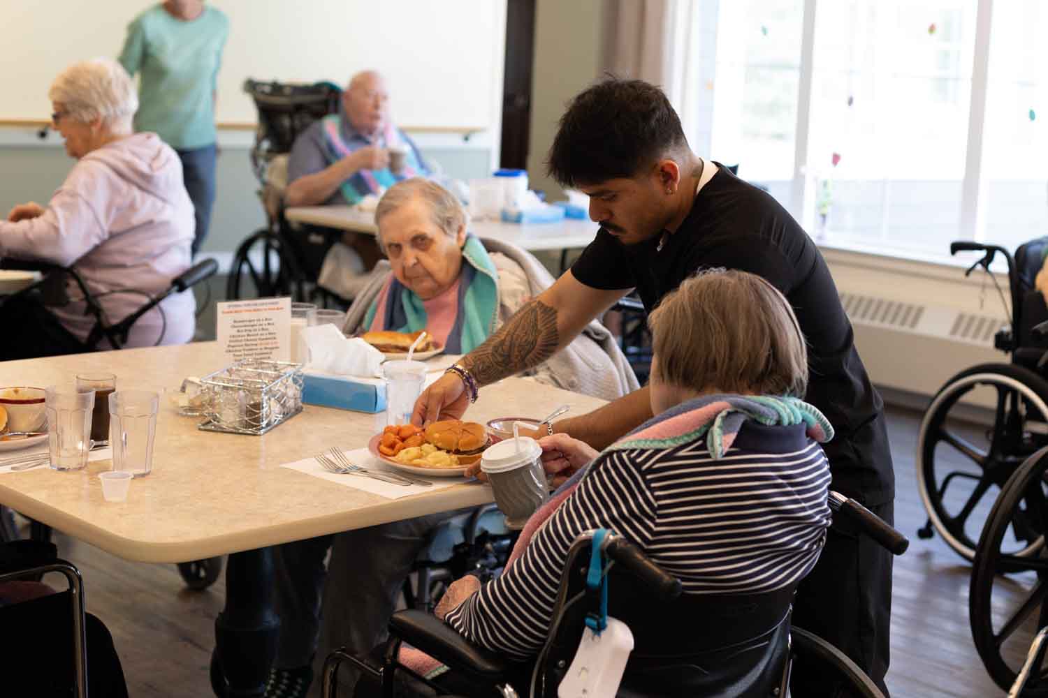 A staff member assisting a resident