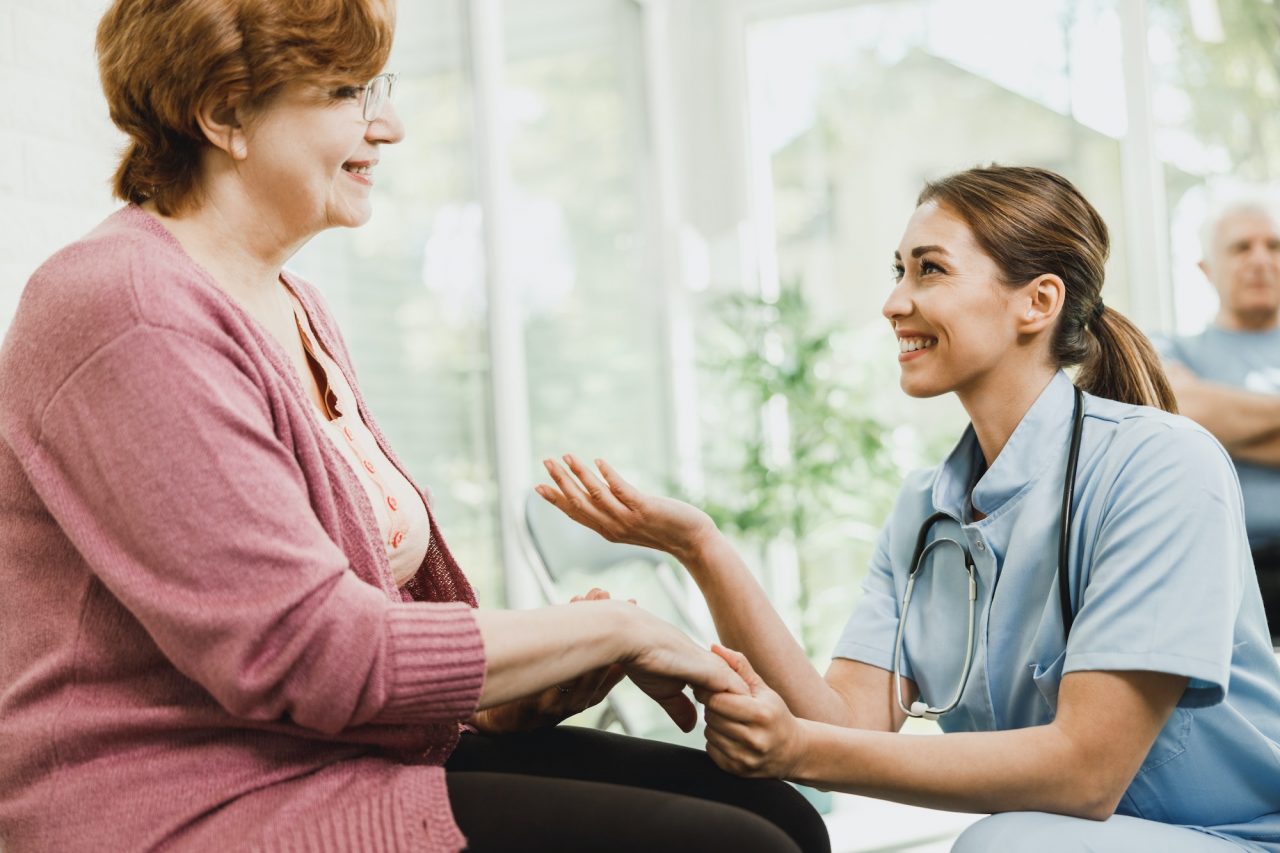 A nurse talking with a senior resident